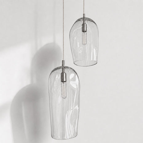 Marea I handblown amber glass pendant lights by Llewelyn Ash suspended together in a contemporary interior.