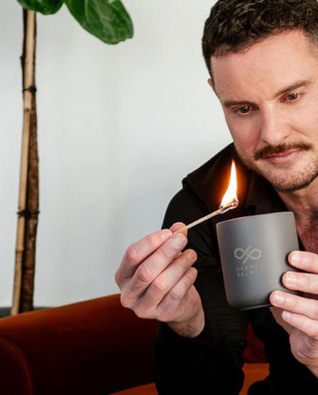 Darren Palmer lighting the Skinny Dip scented candle designed for Contemporary Co
