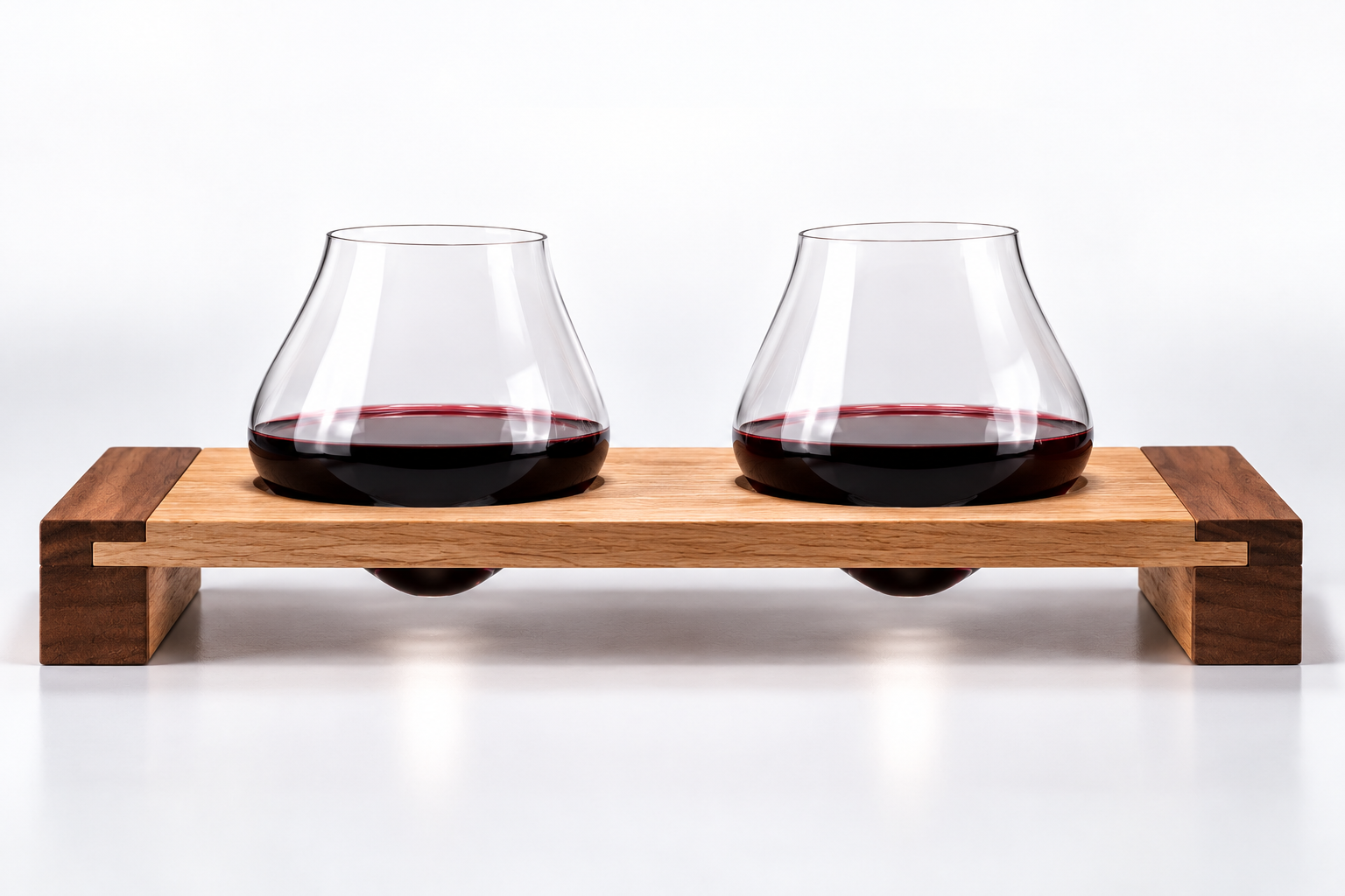 Emma Klau Kinetic stemless wine glasses displayed upright in handcrafted wooden wine glass rack