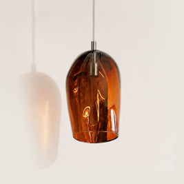 Marea I Amber Australian made handblown glass pendant light with stainless steel fitting, shown unlit.