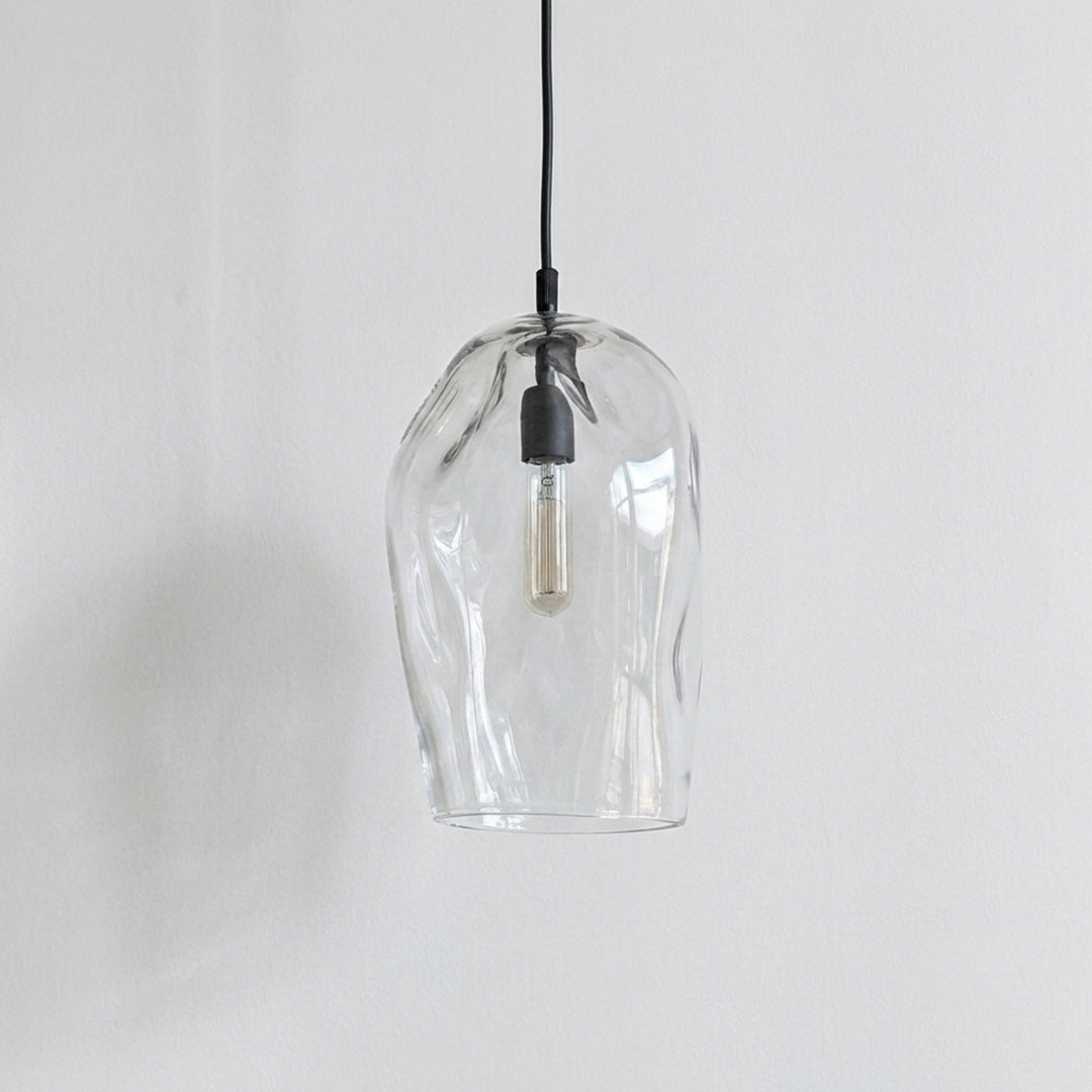 Marea I Clear Australian made handblown glass pendant light with black fitting, shown unlit.
