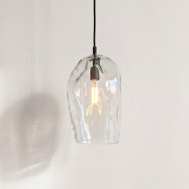 Marea I Clear Australian made handblown glass pendant light with black fitting, shown illuminated.