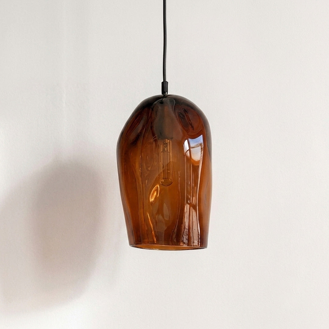 Marea I Amber Australian made handblown glass pendant light by Llewelyn Ash with black fitting, shown unlit.