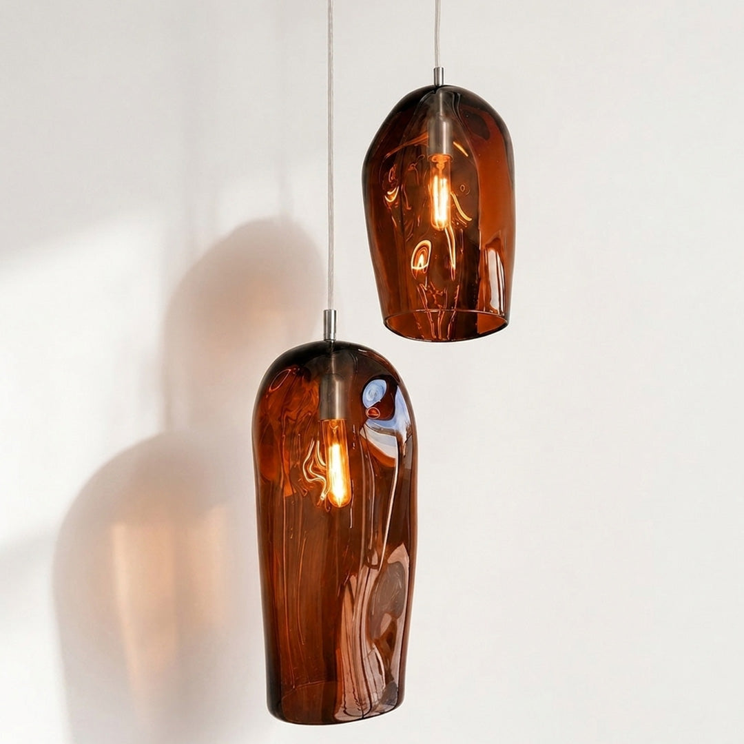 Marea I Amber Australian made handblown glass pendant light by Llewelyn Ash with stainless steel fitting, illuminated.