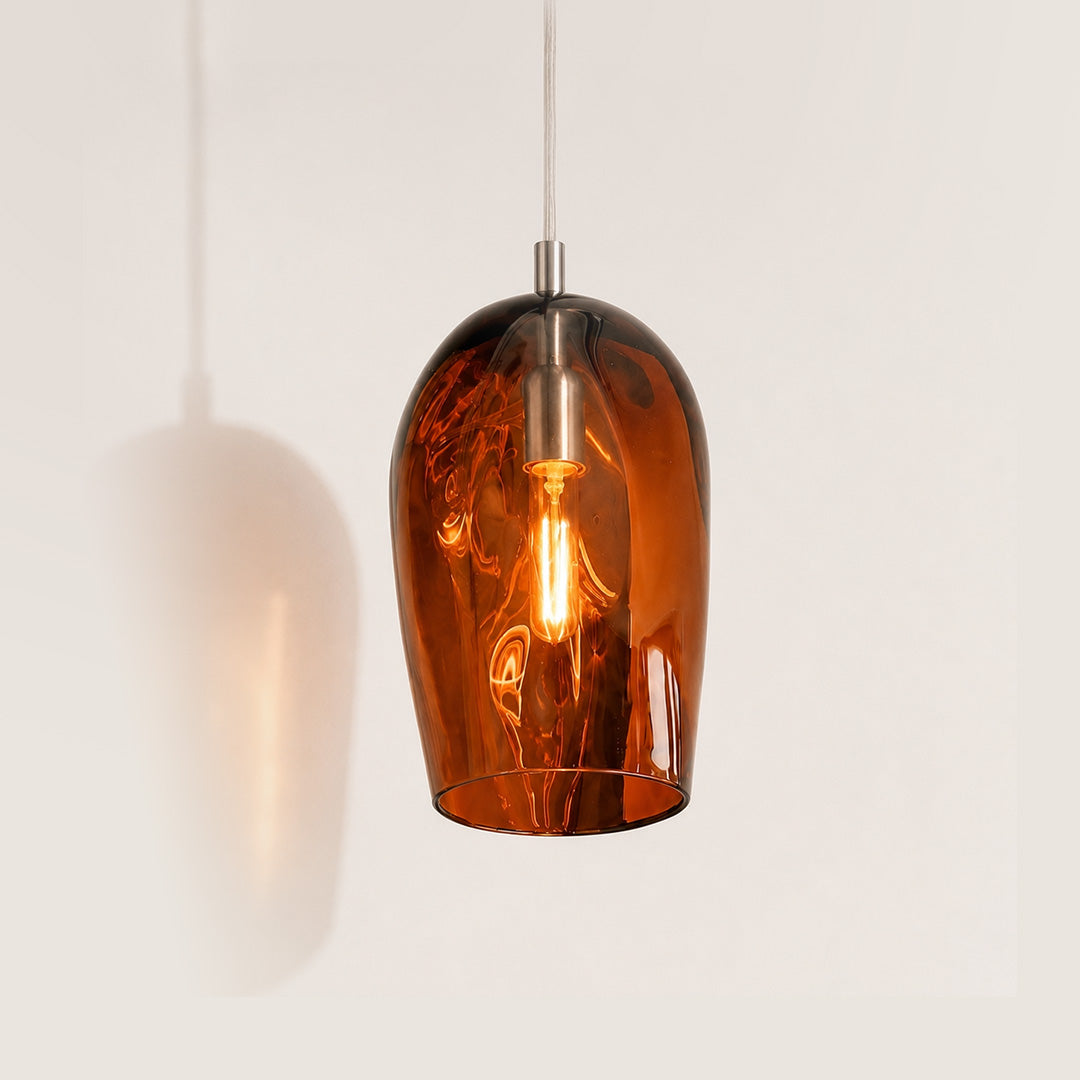 Marea I Amber Australian made handblown glass pendant light by Llewelyn Ash with stainless steel fitting, illuminated.