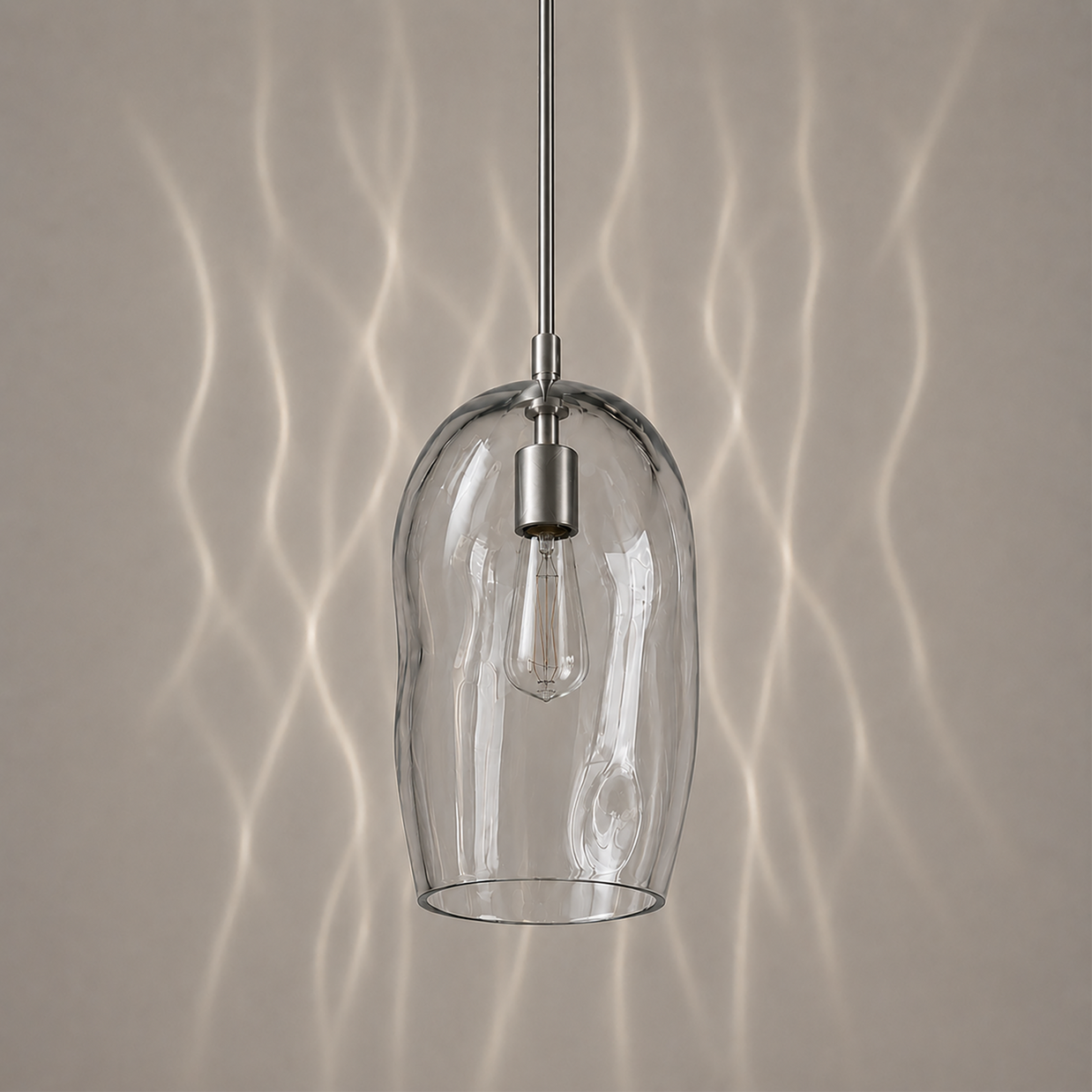 Marea I amber handblown glass pendant light switched off showing the natural glass colour.