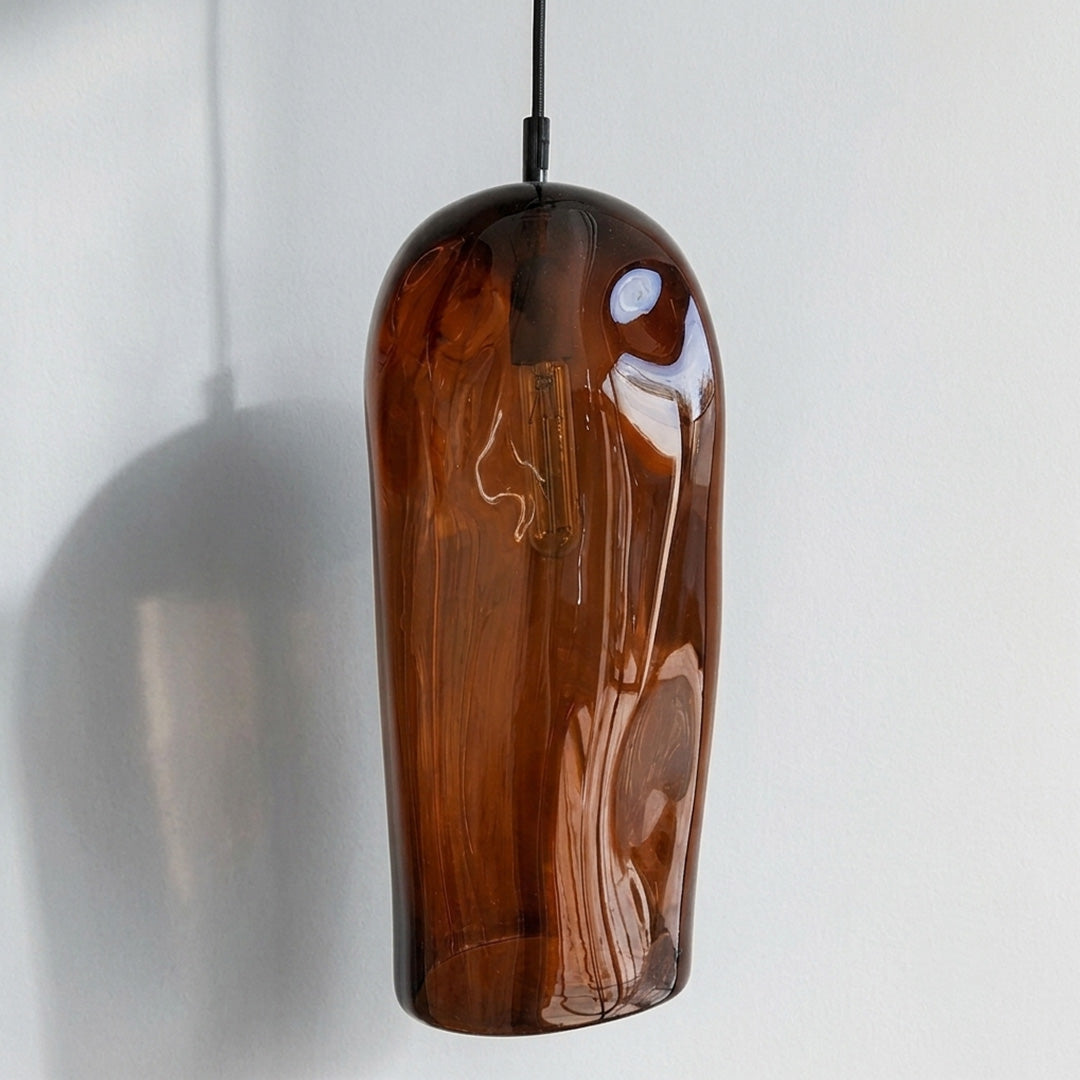 Marea II Amber Australian made handblown glass pendant light by Llewelyn Ash with black fitting, shown unlit.