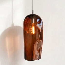 Marea II Amber Australian made handblown glass pendant light by Llewelyn Ash with stainless steel fitting, illuminated.