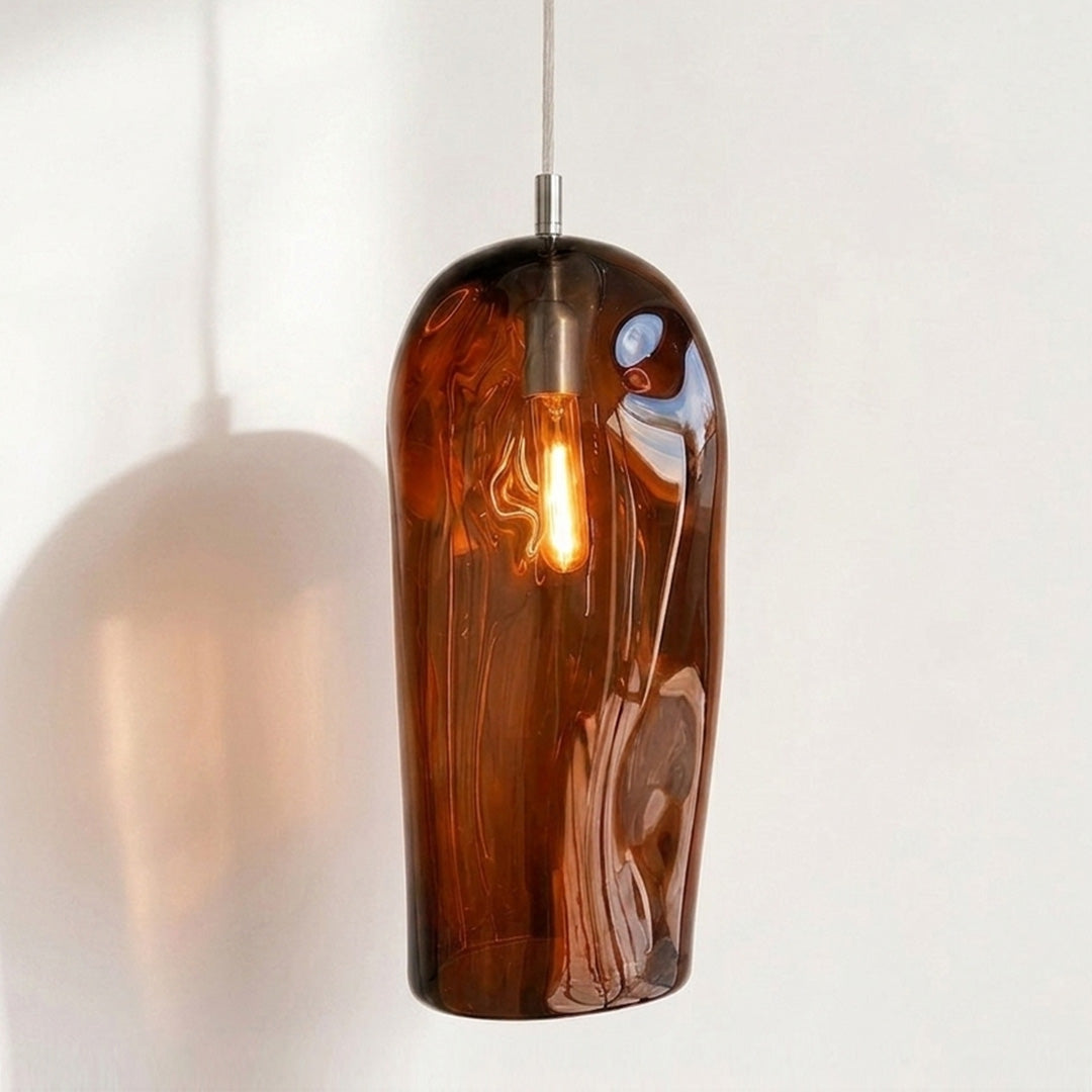 Marea II Amber Australian made handblown glass pendant light by Llewelyn Ash with stainless steel fitting, illuminated.