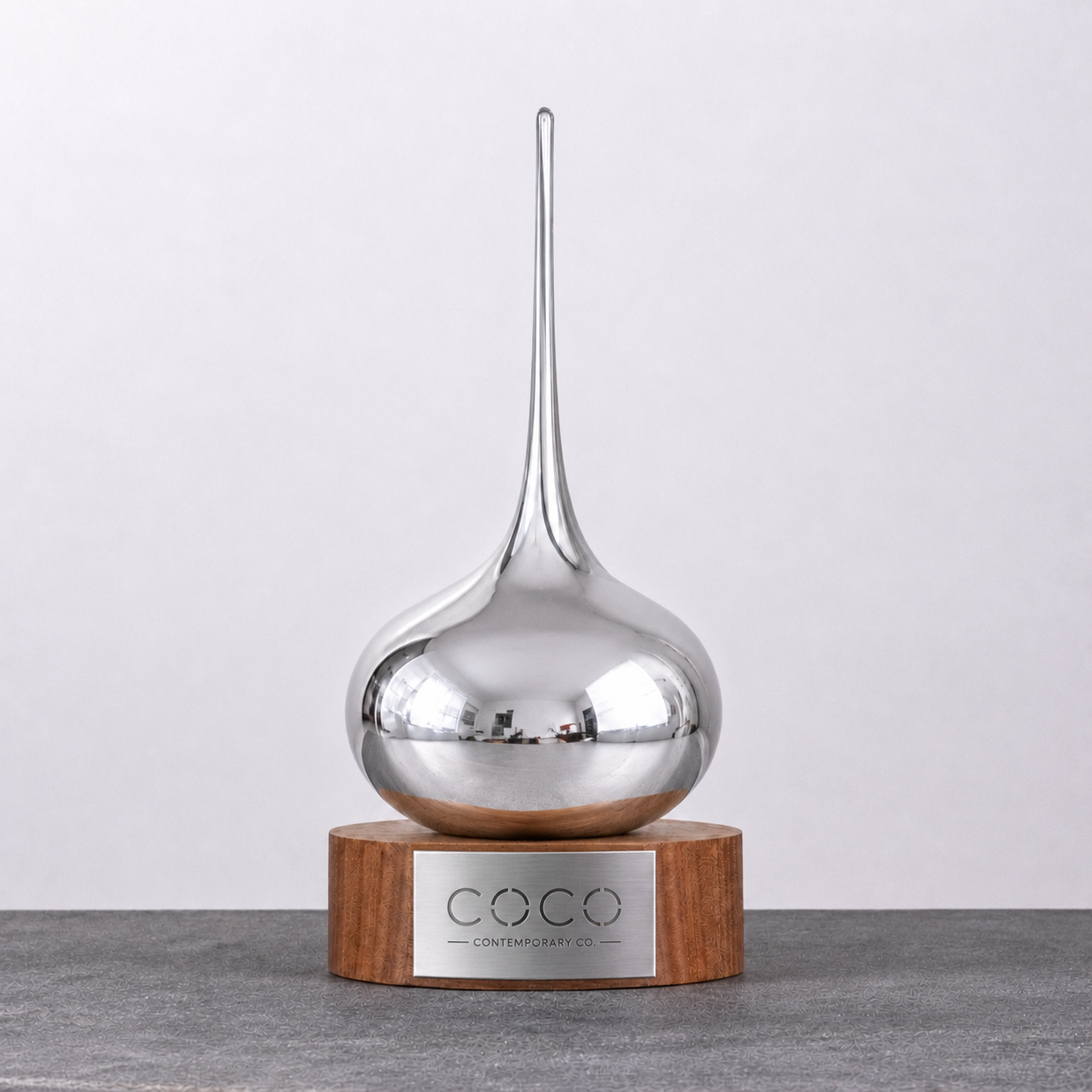 Handcrafted silver Lucky Drop glass award on a timber base by Contemporary Co – premium Australian corporate award and executive recognition trophy.