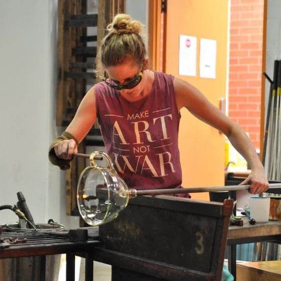 Emma Klau handcrafting a Kinetic Wine Decanter in her South Australian glass studio. Australian handblown art glass made using traditional glassblowing techniques.